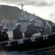 Japanese Coast Guard members, photo credit: AP